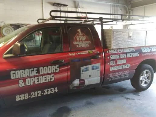 1 Stop Garage Doors & Openers pickup truck with ladder rack and toolbox