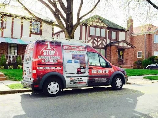 1 Stop Garage Doors & Openers service van parked outside a Tudor-style home on Long Island